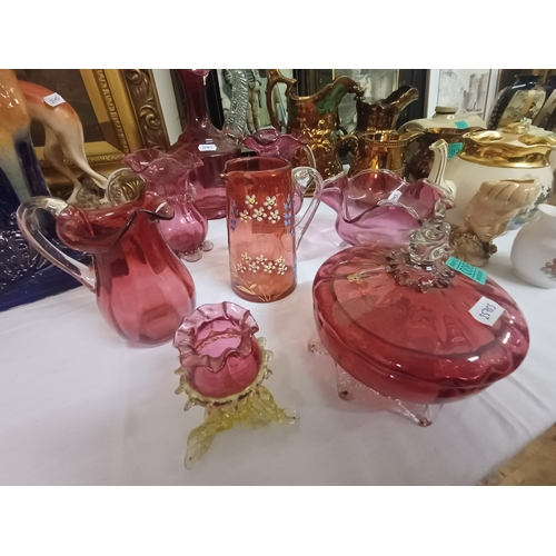 85 - Collection of Cranberry Glass including Decanter, Jugs, Lidded Jar and Bowl