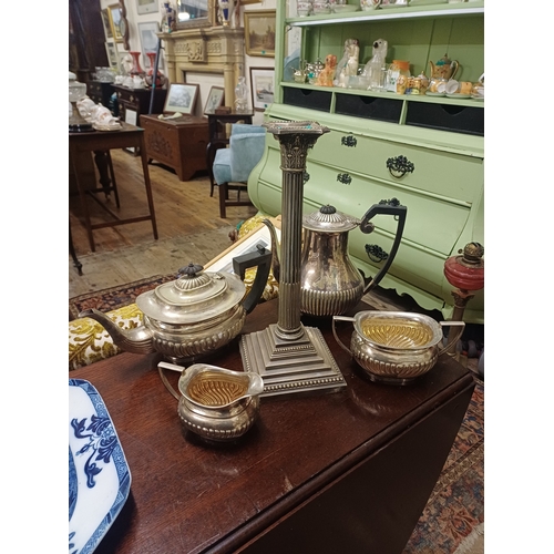 106 - Tall Silver Plate Candlestick of Corinthian Form together with a 4 Piece Silver Plate Tea Set