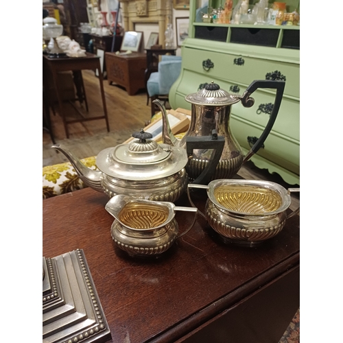 106 - Tall Silver Plate Candlestick of Corinthian Form together with a 4 Piece Silver Plate Tea Set