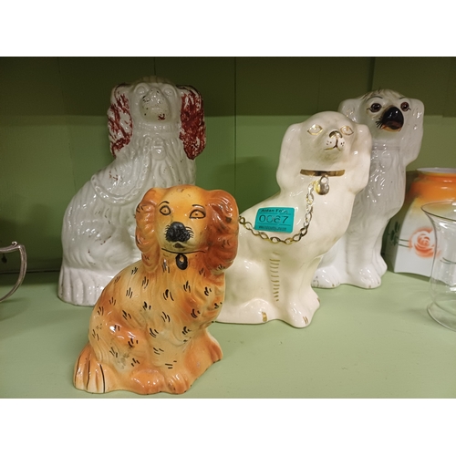 67 - Lot of 4 Staffordshire Pottery Dogs