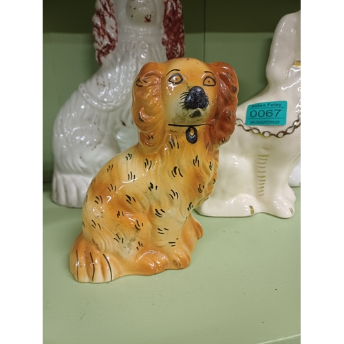 67 - Lot of 4 Staffordshire Pottery Dogs