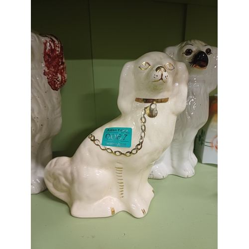 67 - Lot of 4 Staffordshire Pottery Dogs