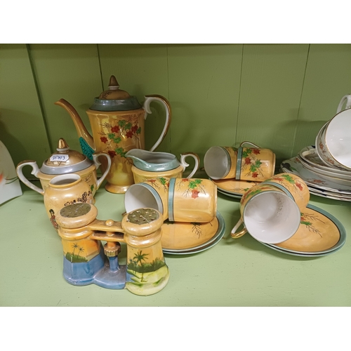 69 - Oriental 17 Piece Pottery Coffee Set and a 21 Piece Bone China Tea Set