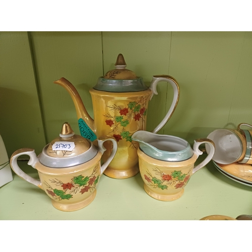 69 - Oriental 17 Piece Pottery Coffee Set and a 21 Piece Bone China Tea Set