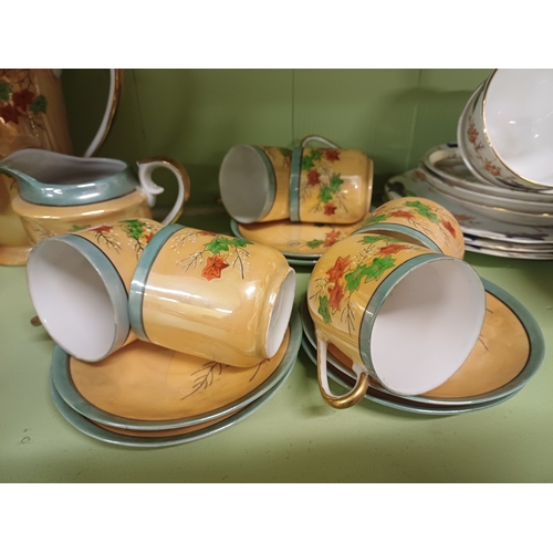 69 - Oriental 17 Piece Pottery Coffee Set and a 21 Piece Bone China Tea Set