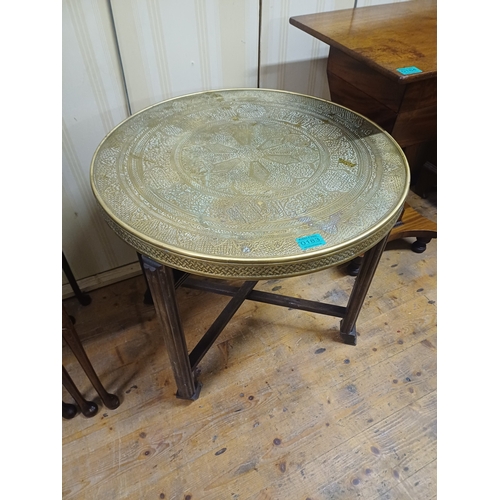 183 - Indian Benares Brass Top Occasional Table with carved Wood Folding base