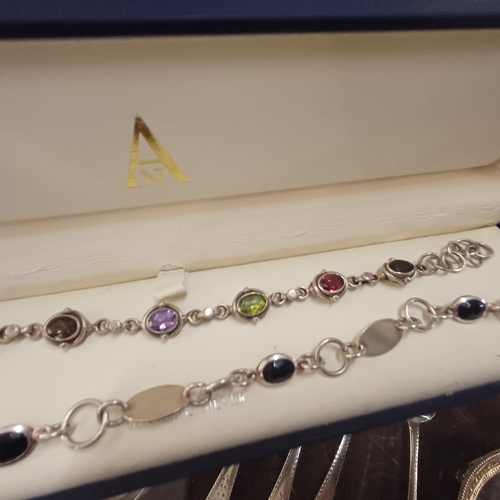 391 - Two decorative Bracelets, one with birthstone gemstones
