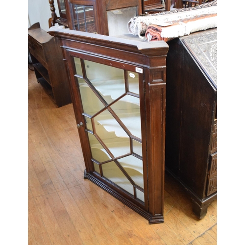 1137 - A 19th century stained pine hanging corner cupboard, with a bar glazed door, 80 cm wide