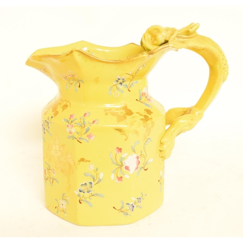 573 - A Mason's Ironstone jug, decorated flowers on a yellow ground, handle restored, 18 cm high, a pair o... 