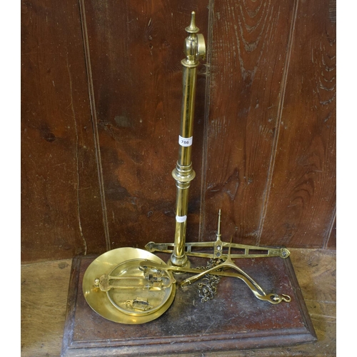 786 - A set of Parnell brass scales, on a wooden base, 60 cm wide