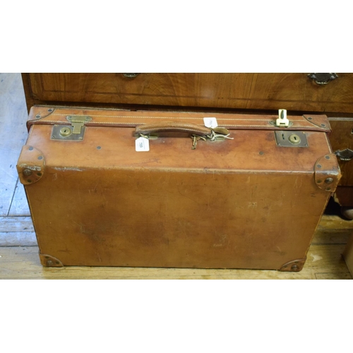 789 - A leather suitcase, initialled G H, 77 cm wide