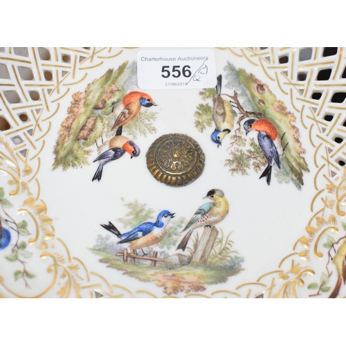 556 - An Augustus Rex porcelain part dessert service, painted birds and with gilt decoration, comprising a... 