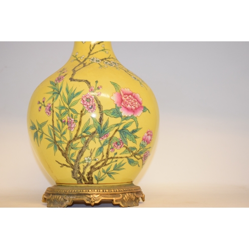 548 - A Chinese vase, decorated prunus on a yellow ground, converted to table lamp, 68 cm high (including ... 