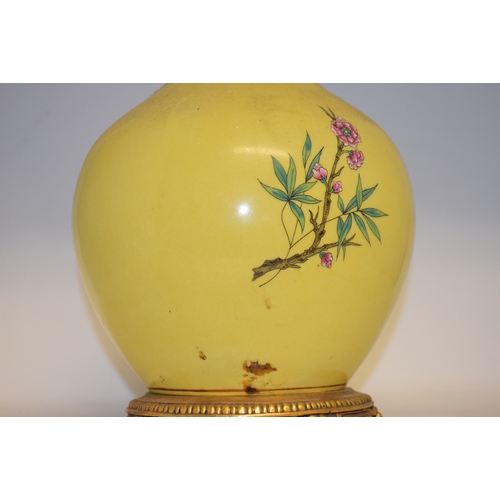 548 - A Chinese vase, decorated prunus on a yellow ground, converted to table lamp, 68 cm high (including ... 