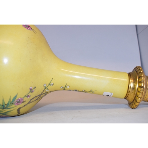 548 - A Chinese vase, decorated prunus on a yellow ground, converted to table lamp, 68 cm high (including ... 