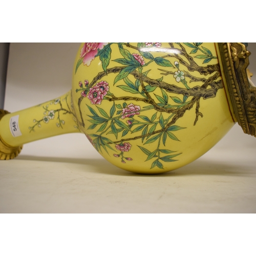 548 - A Chinese vase, decorated prunus on a yellow ground, converted to table lamp, 68 cm high (including ... 