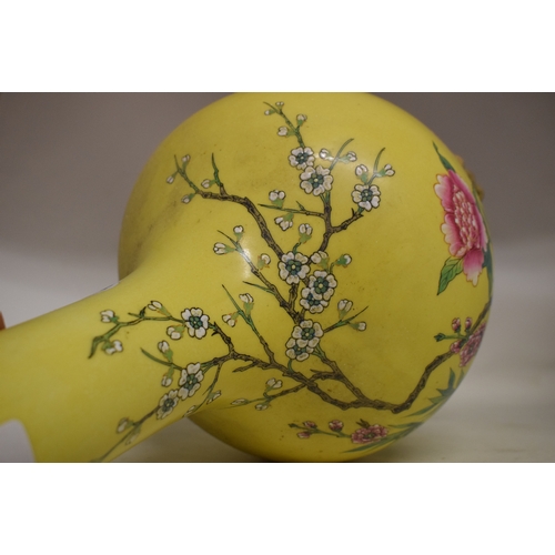 548 - A Chinese vase, decorated prunus on a yellow ground, converted to table lamp, 68 cm high (including ... 