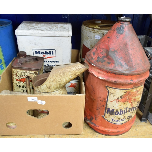 307 - Assorted Mobil oil cans and pourers, including a five gallon conical can, one gallon oil jug and oth... 