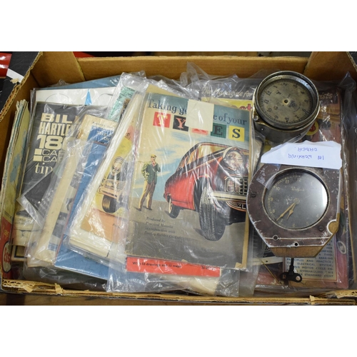 515 - Two classic car dashboard clocks, assorted car manuals and brochures (box)