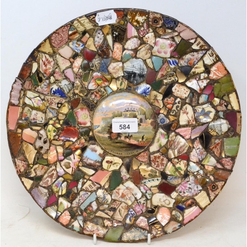 584 - A pique assiette folk art charger, the centre inset a pot lid, Walmer Castle, 34.5 cm diameter