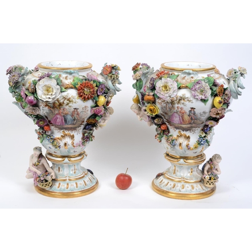 616 - A pair of late 19th/early 20th century Dresden porcelain vases, painted classical figures, applied c... 