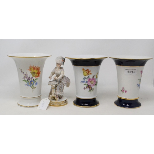 621 - A pair of Meissen porcelain vases, decorated flowers, 16 cm high, another similar and a Meissen figu... 