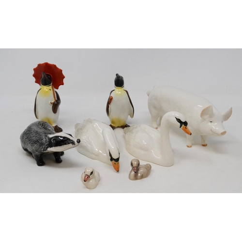 625 - A Beswick Swan, head up, 1684, another, head down, 1685, two Cygnets, 1686 and 1687, a Badger, 3393,... 