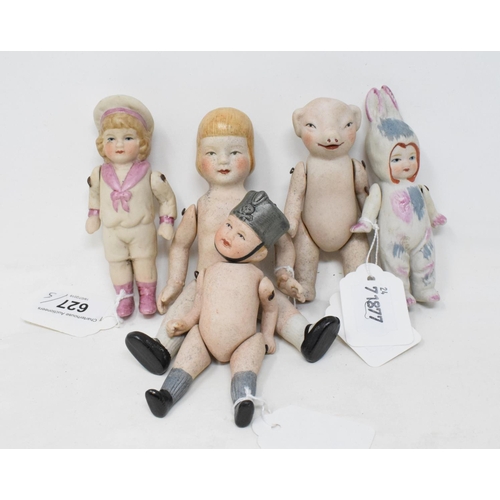 627 - A bisque doll, 15 cm high, and four others similar (5)