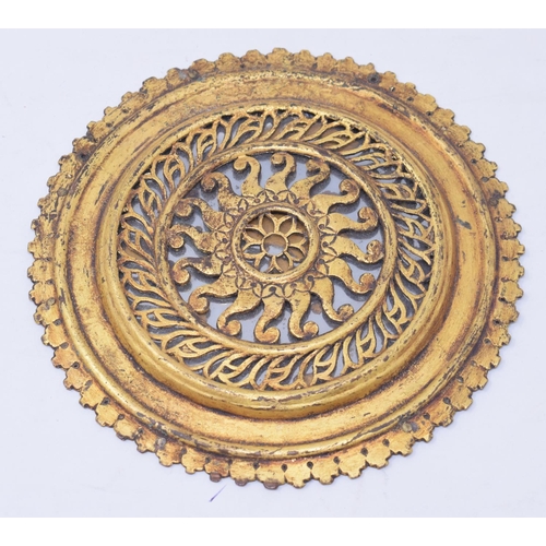 792 - An Indian gilded copper chakra, 15.5 cm diameter