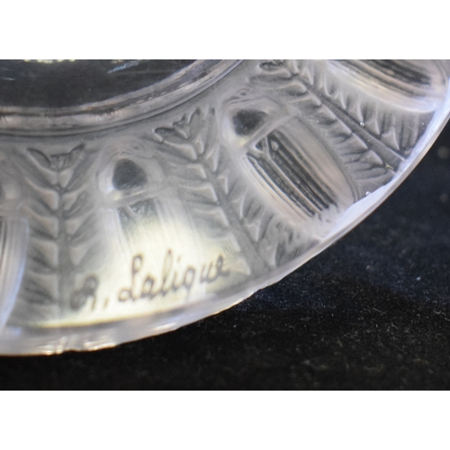 624 - A Lalique Tobago opalescent glass dish, decorated scarab type beetles, 14 cm diameter See illustrati... 