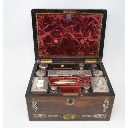 5 - A Victorian travelling dressing case, with silver plated mounts, the rosewood case inlaid with mothe... 