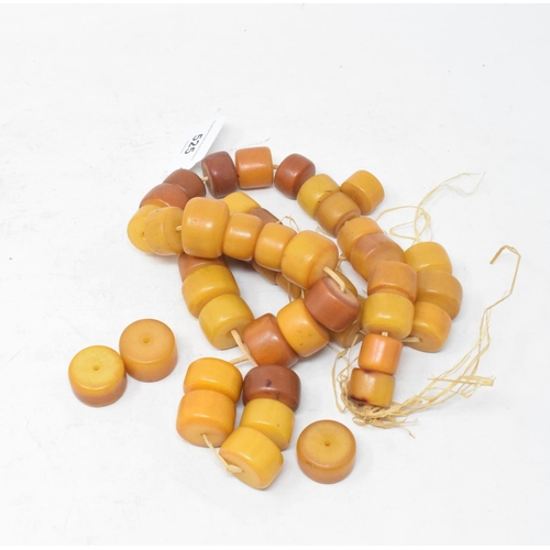 525 - A string of amber type beads, 70 cm