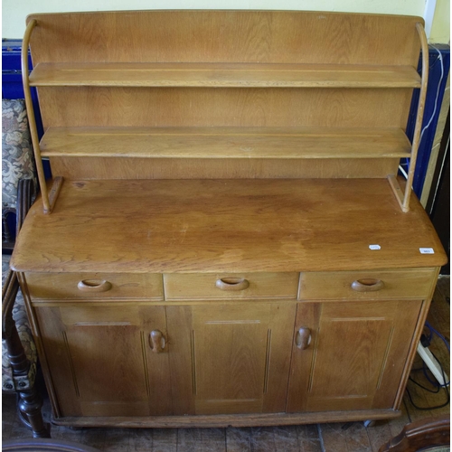 983 - An Ercol style elm dresser and plate rack, 122 cm wide