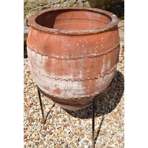 985 - A garden terracotta amphora, on a metal stand, 58 cm diameter