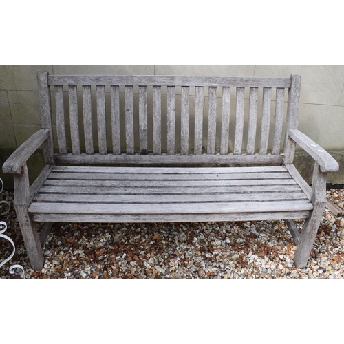 986 - A pair of teak garden benches