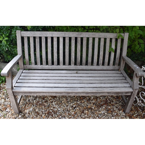 986 - A pair of teak garden benches