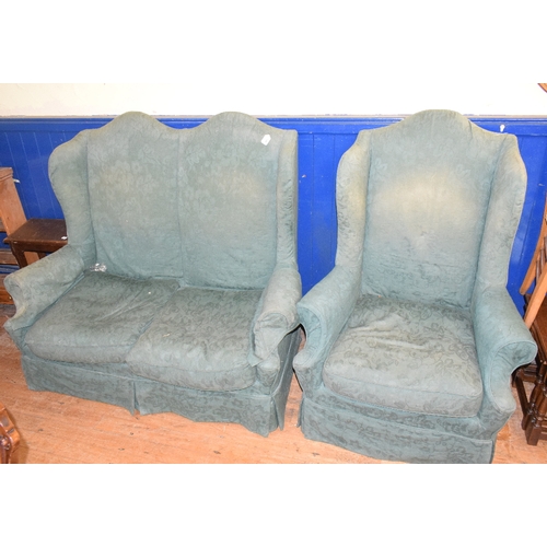 987 - A two seater wing back settee, a matching armchair and another armchair (3)