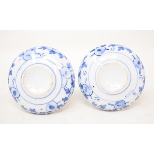 589 - A pair of oriental porcelain vases, with underglaze blue decoration, 8.5 cm high (2)