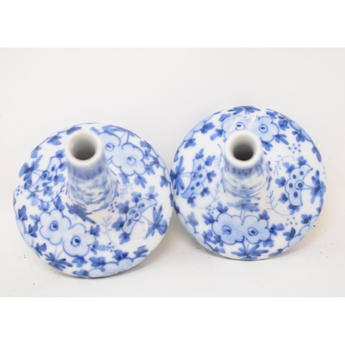 589 - A pair of oriental porcelain vases, with underglaze blue decoration, 8.5 cm high (2)