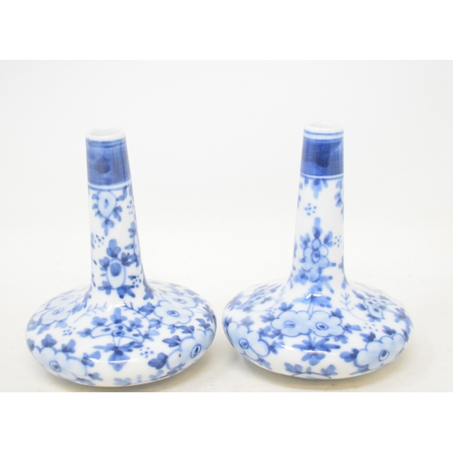 589 - A pair of oriental porcelain vases, with underglaze blue decoration, 8.5 cm high (2)