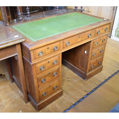 1162 - A late Victorian walnut pedestal desk, having a leather inset writing surface above an arrangement o... 