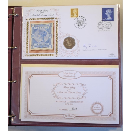 13 - An album of philatelic numismatic covers, some signed