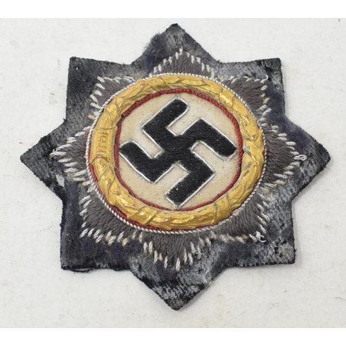 212 - A German World War II cloth Cross in Gold, some wear