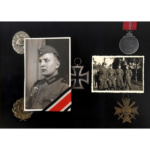 215 - A group of mid 20th century German items, belonging to Wilhelm Bohn, including an iron cross, wound ... 