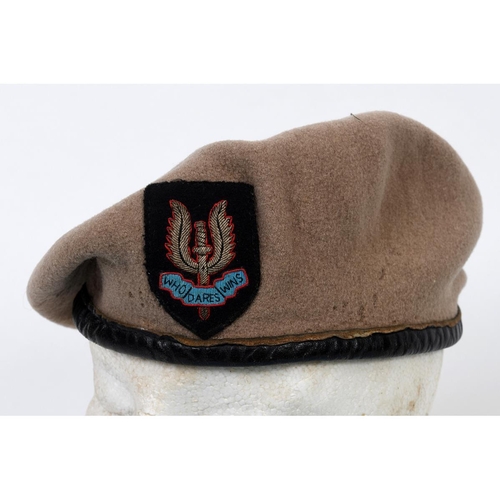 217 - A Special Air Service Regiment sand coloured beret, with a black leather trim and black ribbon runni... 