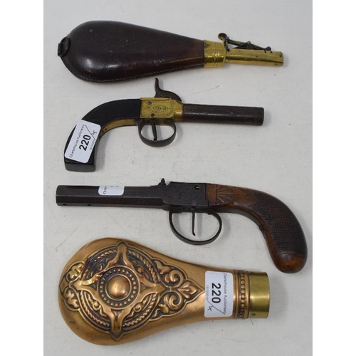 220 - A 19th century percussion cap pistol, 18 cm, another pistol, a shot flask and a powder flask (4)