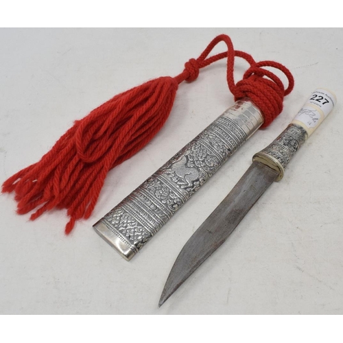 227 - A Malaysian style dagger, the scabbard with silver coloured metal mounts, probably early 20th centur... 