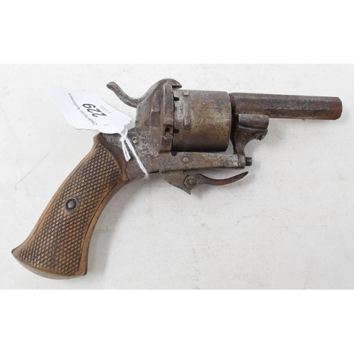 229 - A rimfire pistol, with a wooden grip, 16 cm