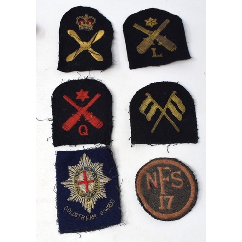 233 - Assorted military buttons, pips, badges and other items