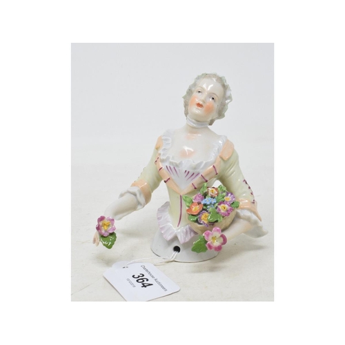 364 - A porcelain half doll, possibly Carl Thieme, a lady flower seller, wearing a light green dress and h... 